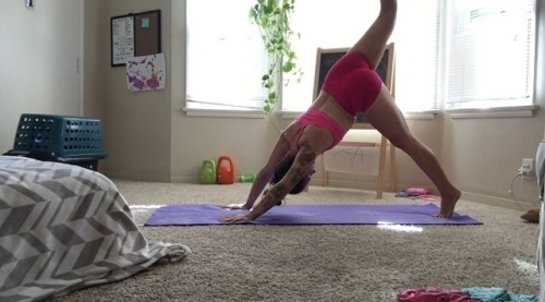 Some yoga after a crazy HIIT workout this morning. also: there is a toddler in that laundry basket c