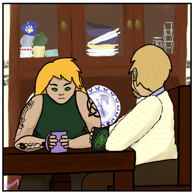 Blodeuwedd Morgan and her uncle Owain are sitting at a wooden table, each holding a mug in their hands. Morgan is a white woman with tawny hair, bright green eyes, and several celtic/Welsh love spoon-inspired tattoos. She is wearing a dark green tank top and a pensive expression. Owain is facing away form the viewer, and is wearing a beige sweater and brown trousers. A Welsh cabinet is visible in the background. The top cabinets are filled with (left) an assortment of mismatched mugs, (middle) mismatched plates, and (right) drinking glasses. Behind Morgan is a decorative porcelain plate.