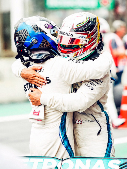 electric-arc:Lewis Hamilton celebrates with his team mate Valtteri Bottas after winning the F1 Brazi