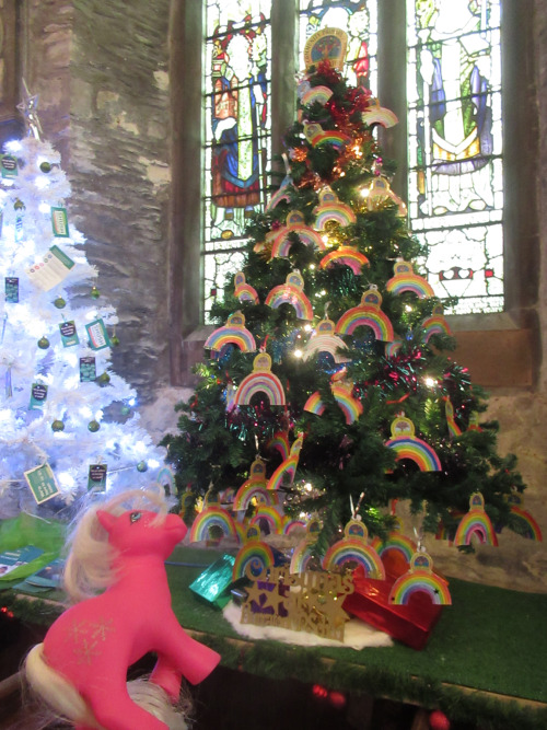 Snowflake poses with a Christmas tree.At the Christmas tree festival at St Nicholas and St Faith chu