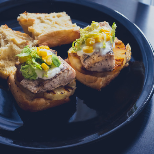 Mahi mahi sliders with grilled pineapple, corn brussel sprout slaw and lime sour cream :)