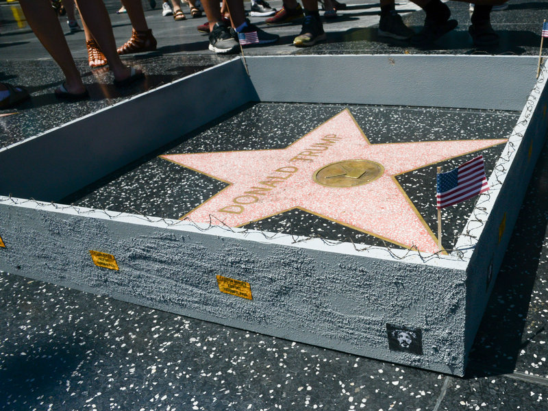 tastefullyoffensive:  Street artist Plastic Jesus built a tiny border wall around