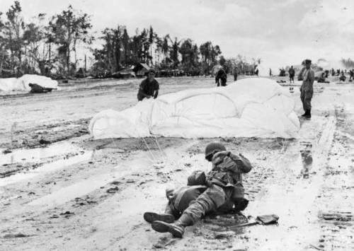 An American soldier parachuting onto the island of Iwo Jima