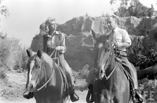 Inger Stevens getting riding lessons from jockey Johnny Longden(Allan Grant. 1960?)