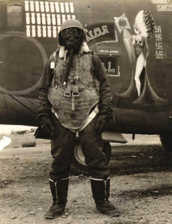 historicaltimes:  A B-24 crewman stands beside