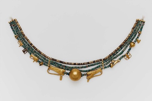 grandegyptianmuseum: Beaded collar with amulets The central motif of this small, elegant collar, is 