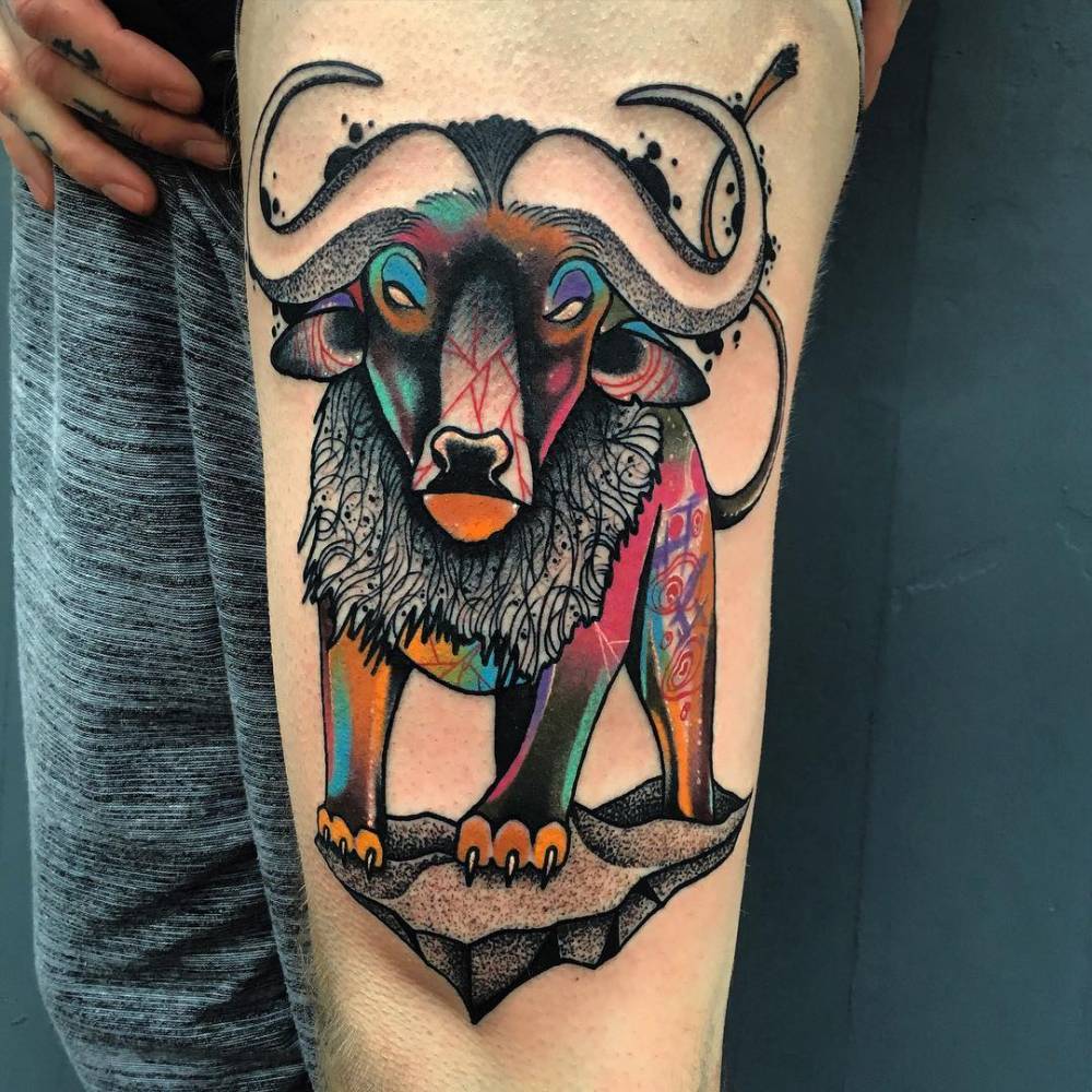 tattoofilter:  Psychedelic buffalo lion tattoo on the left thigh. Tattoo artist: