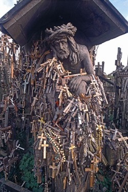 Statue of Christ and crosses left by pilgrims,