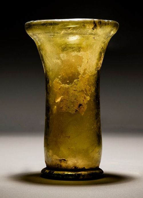 jebruce: A Roman Amber Flaring Glass Wine Beaker. 100 C.E. - 300 CE.