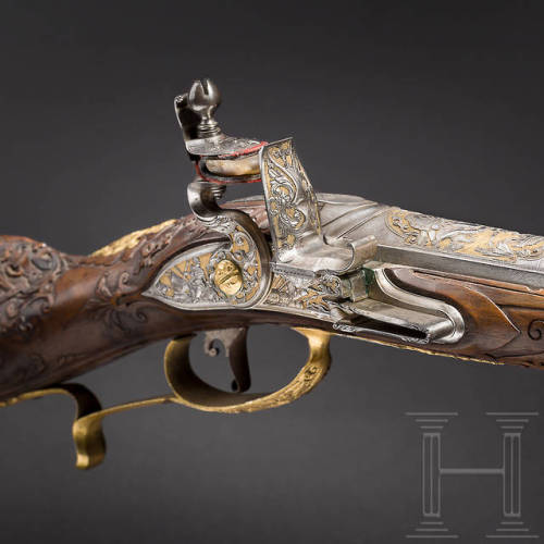 Gold inlaid and relief carved flintlock fowler crafted by D. Meyer of Vienna, circa 1730.from Herman
