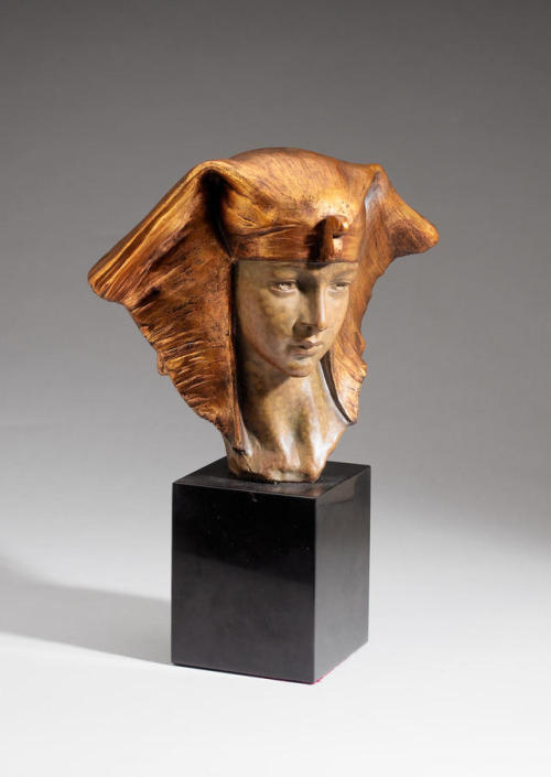 Egyptian QueenA gilt terracotta bust, circa 1925. Modeled wearing an Egyptian nemes headdress with a