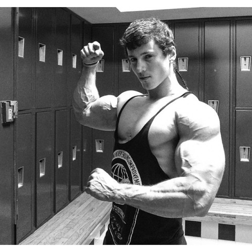 beautifulyoungmuscle:The stunning flexed biceps of Zach Zeiler. Piled high with muscle, studded with veins, rippling with mass and power, they’re erotic totems of beautiful young muscle.