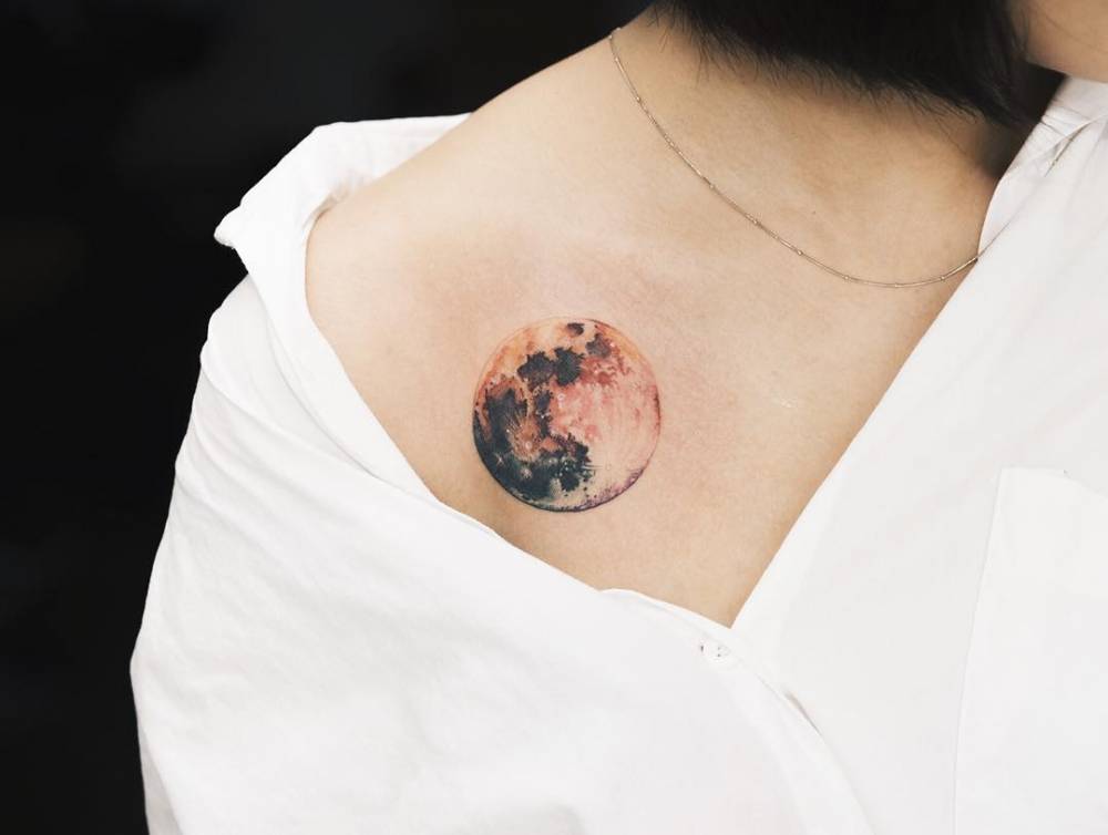 tattoofilter:  Watercolor style moon on between chest and shoulder. Tattoo artist: