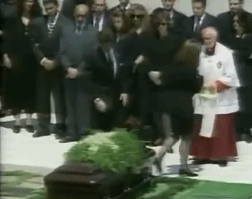 kennedy-gifs:John F. Kennedy Jr. kissing the coffin of his mother, 1994.