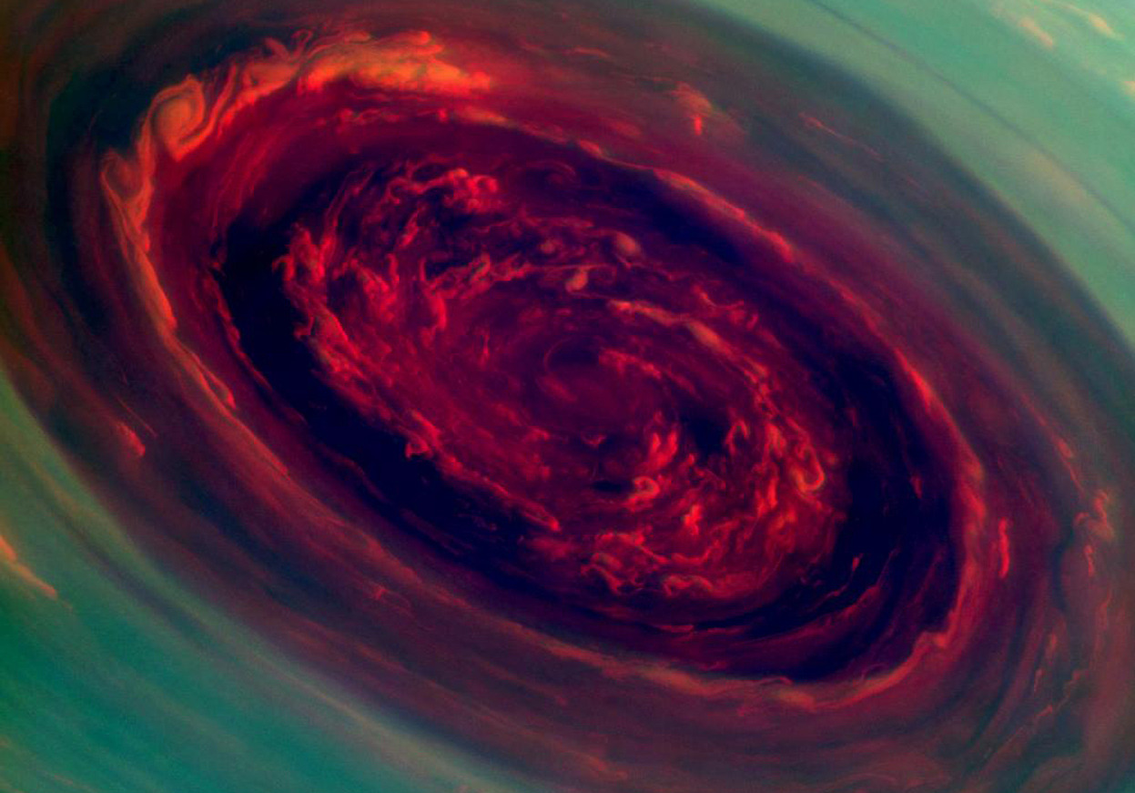 From Images of Saturn From the Cassini Mission, one of 36 photos. The spinning vortex of Saturn’s north polar storm resembles a deep red rose of giant proportions surrounded by green foliage in this false-color image from NASA’s Cassini spacecraft....