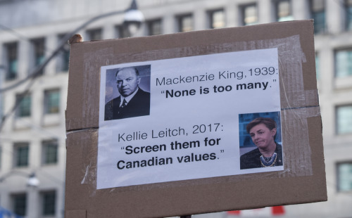 Signs from the National Day of Action against Islamophobia and White Supremacy in Toronto. Lots of c