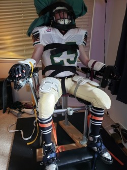 hockeydogwoof:Strapped into the bondage chair in full San Jose Sabre Cats football gear.