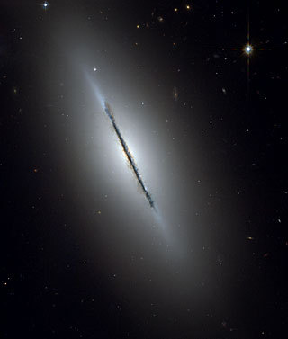 This is a unique NASA/ESA Hubble Space Telescope view of the disk galaxy NGC 5866 tilted nearly edge on to our line-of-sight.
Credit: NASA/ESA and The Hubble Heritage Team (STScl/AURA)