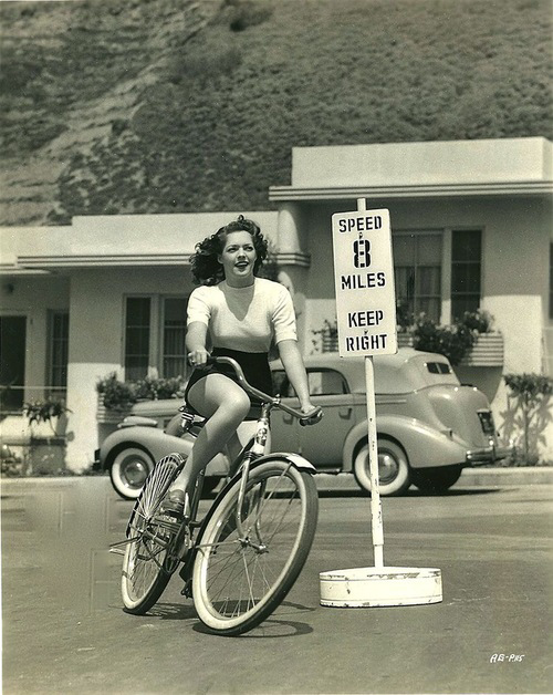 dazzledent:  Summer 2014, day 9: Actress Anne Gwynne exceeding the speed limit, circa early 1940s (with a 1940 Packard 120 in the background.) 