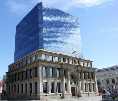 architectura:Cubic glass building embedded in an old facade.  Valparaiso, Chile.