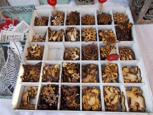 Interesting merchandise made of wood. Christmas market offer in the city Wroclaw, Poland.