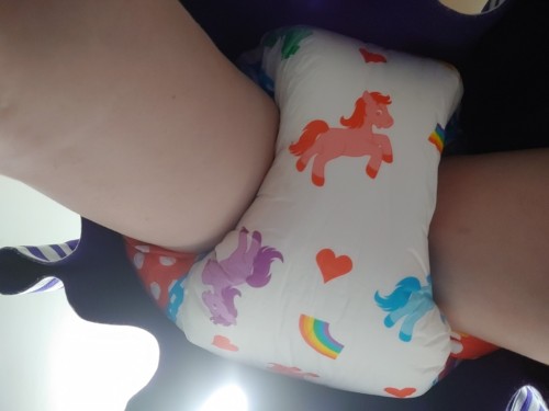 There was no way she could hide it. Bright colours, loud crinkles and ludicrously thick, this diaper