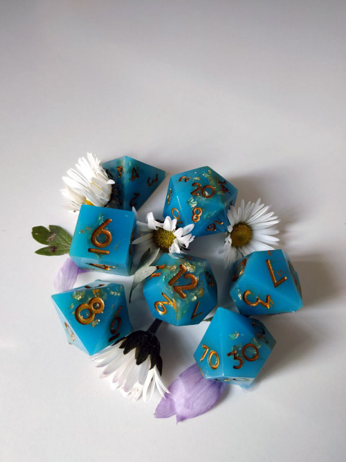 juspeczik:My first set of dice Handmade! Opaque cyan with gold leaf mixed with resin. Golden numbers