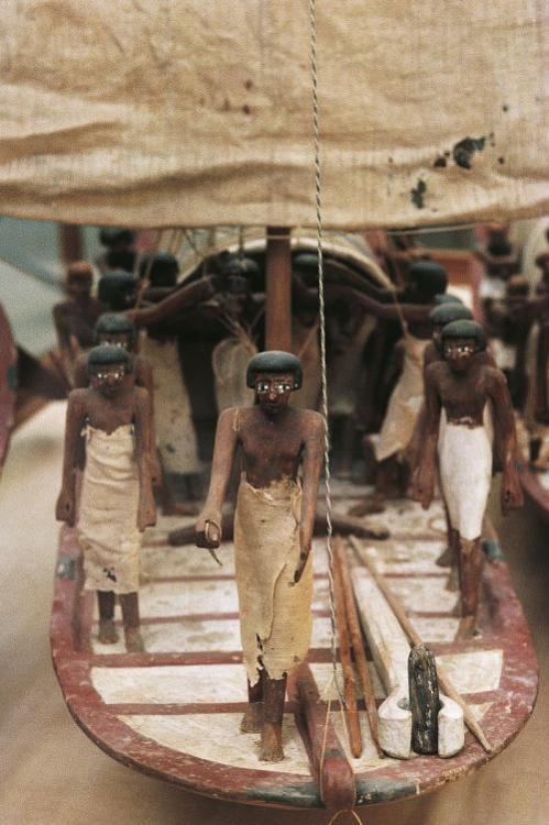 Model Boat with Crew Sailing UpstreamThe traditional model of a boat depicts the crew sailing upstre