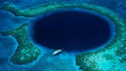 congenitaldisease:  The Great Blue Hole is a large submarine sinkhole located off the coast of Belize. It is over 300m across and 124m deep.