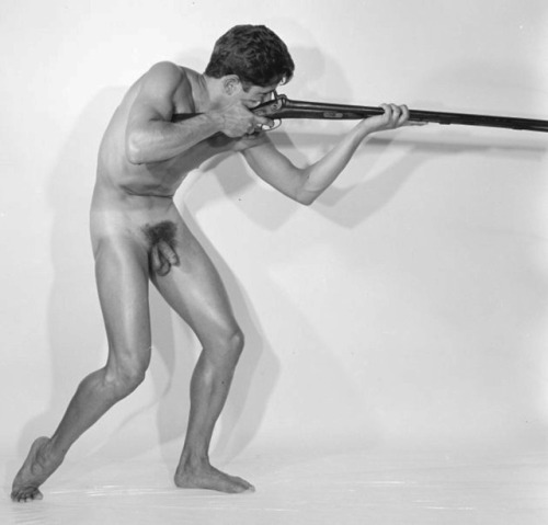 vintagemusclemen:The antique musket is long and lean … and so is the man.