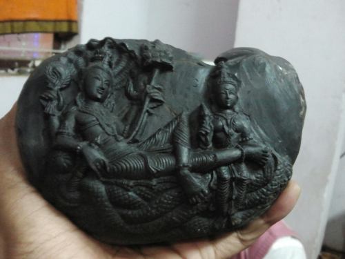 Lakshmi and Narayana carved at a sacred salagram sila