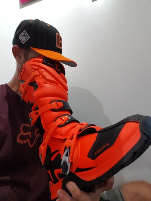 stinkyoursocksupliam:Having a good sniff inside his MotoX bike boot.