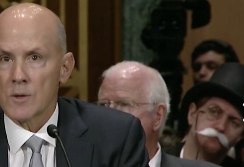 estebanwaseaten: comcastkills: Capitalism himself in the background of the Equifax hearing This was 