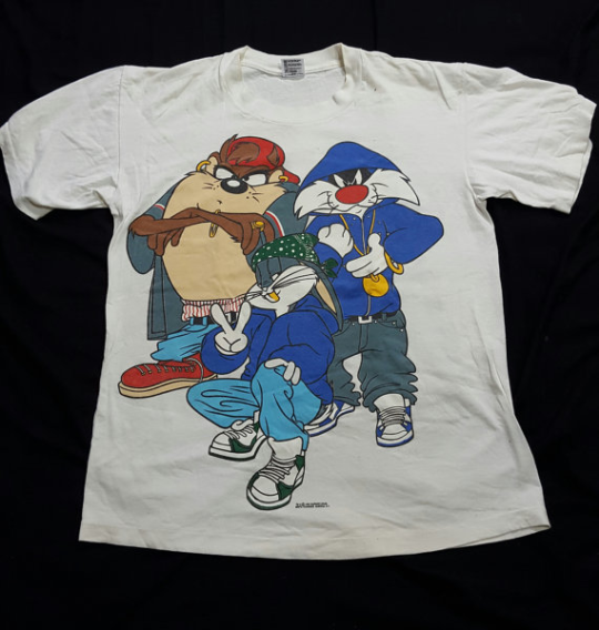 drinking-tea-at-midnight:  cheeralism: axeystuff:   axeystuff:  Don’t let aesthetic blogs fool you, the real 90s aesthetic is “urban” and “attitude”-filled versions of classic cartoon characters on mass-produced merchandise Kudos to Porky