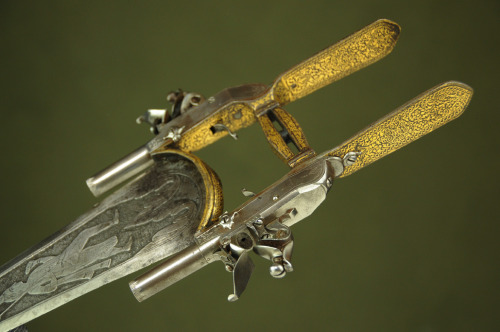 A beautiful gold decorated and engraved Indian katarr dagger with two flintlock pistols.