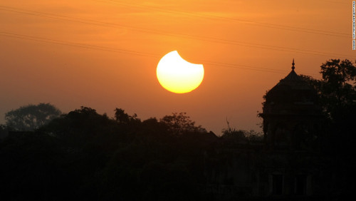 chocolateharmonyperson: sixpenceee: The following are pictures of rare sunset solar eclipses. They a