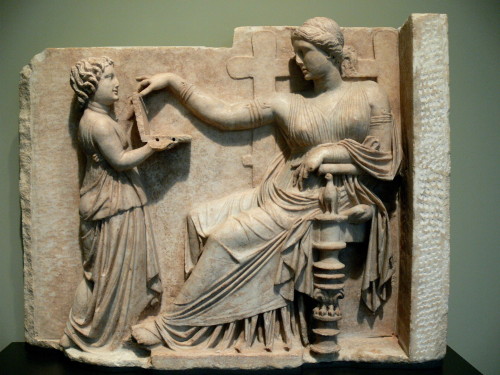 Gravestone, carved in high relief, of a woman attended by a child-slave.  Unknown Greek artist, ca. 