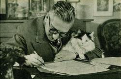 cleowalker:  Jean Paul Sartre at his writing desk. With existentialist kitty. 