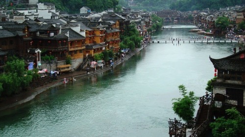 odditiesoflife:  The Ancient Town of Fenghuang, China The town of Fenghuang is located in the Hunan province in China along the banks of the Tuo Jiang River. The town is exceptionally well-preserved and relatively untouched by modern urbanization. The