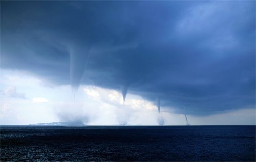 In this phenomenal capture by Roberto Giudici, we see four waterspouts over the Adriatic Sea.A siste