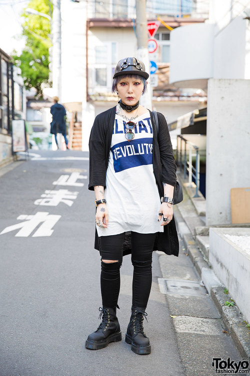 Yui on the street in Harajuku wearing a leather harness cap, a Worlds End t-shirt, skinny jeans, Dr.