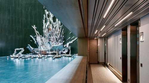 itscolossal:A Multi-Story Metallic Splash by Pere Gifré Drops Through the Center of a Madrid Hotel