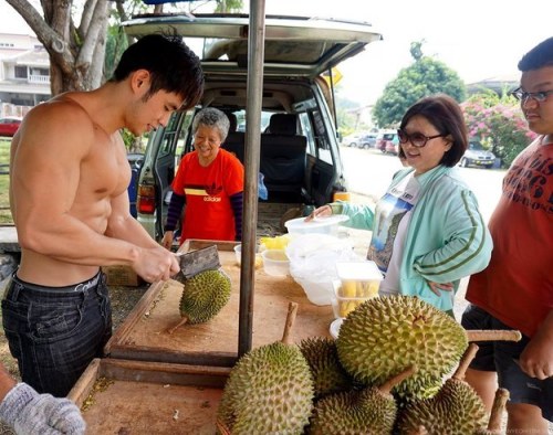 keepemgrowin:  buzzfeed:First, there was the Hot Bean Curd Vendor in Taiwan. Now there’s a Hot Durian Fruit Seller in Malaysia. This is a good trend. Forget the fruit… can I take this muscle hottie home?