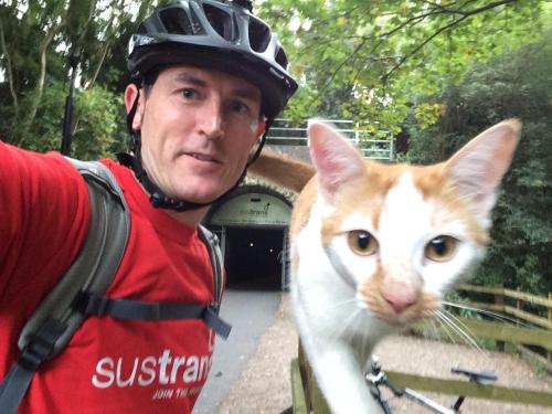 catsbeaversandducks:“When I stopped cycling this cat came out of the woods. I bent down to pet it th