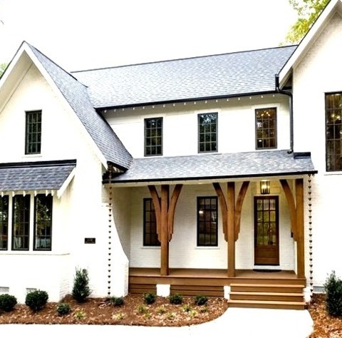 Charlotte BrickLarge Elegant White Two-story Brick Exterior Home Photo With A Shingle Roof