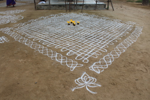 The threshold of a village temple in Bahour commune, Pondicherry adorned with several large kolam de