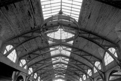 chrisjohndewitt:The Roof of the Hamburger Bahnhof in Berlin. When it was decided to renovate the old railway shed and surrounding buildings into a museum of modern art, a neutral, undecorated decor was required. The large Art Nouveau lamp holders seen