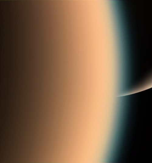 spaceplasma: Peeking at Saturn Cassini peers around the hazy limb of Titan to spy the sunlit south p