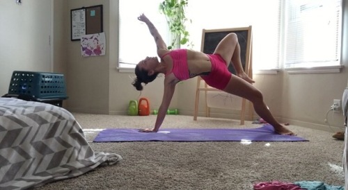 Some yoga after a crazy HIIT workout this morning. also: there is a toddler in that laundry basket c