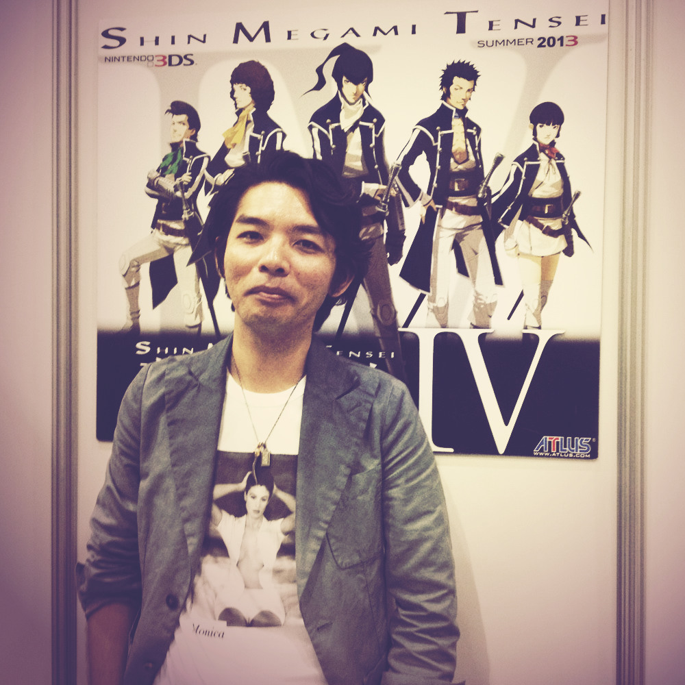 Masayuki Doi, art director for Shin Megami Tensei IV You might have read about this shirt if you spotted USgamer’s chat with Doi. Before our own E3 interview with him, a fellow from Nintendo stopped by to take a photo of the artist for social media...